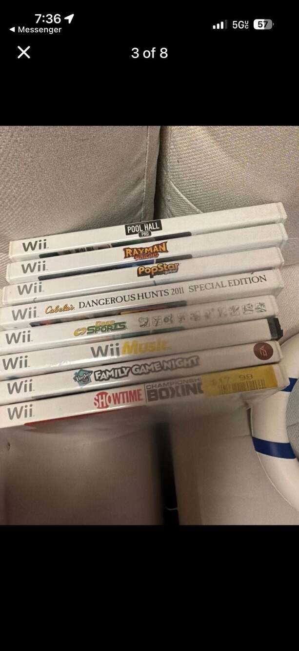 Nintendo Wii Bundle with 9 Games, 2 Controllers, and Nerf Steering Wheel